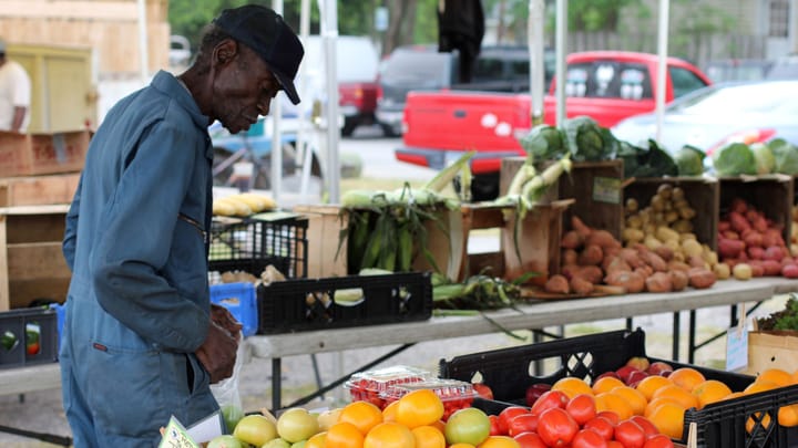 Image of a black man at a farmer's market